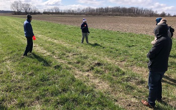 Members of the SAVANT team checking topography for the project.